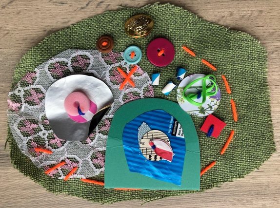 A collection of textiles, buttons and other recycled materials are grouped together and made into giant textile sequins.