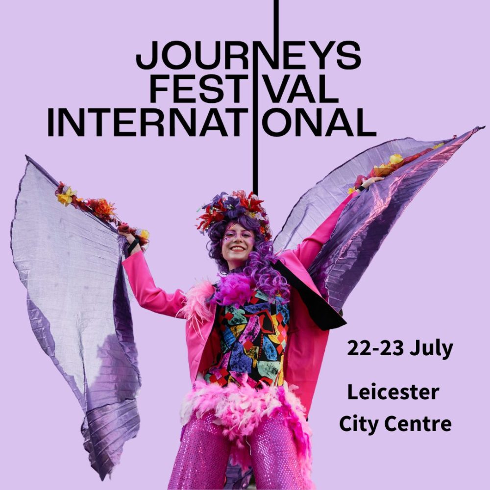 This image shows a logo for Journeys Festival International. It has some dates on it and a picture a carnival dancer, on stilts.