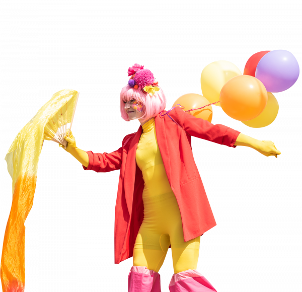 A cut-out image of a performer in a colourful costume in yellow and red, carrying balloons in yellow, orange, red and purple.